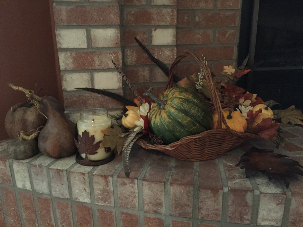 Fall decorations on a fireplace hearth